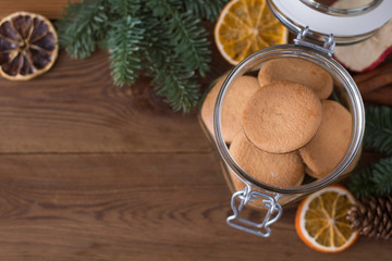 Shortbread cookies, biscuits in glass jar, wooden table. Christmas biscuits. Copy space.