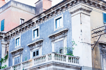 Balcony in a historic building in Catania, traditional architecture of Sicily, Italy.