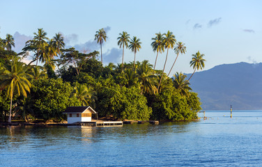 A small wooden jetty in the lagoon near the Bora-Bora island in the Leeward group of the Society Islands of French Polynesia. - obrazy, fototapety, plakaty