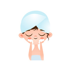 Young cute little girl caring for her problem skin on her face washes off the remnants of the mask with water after the procedure.