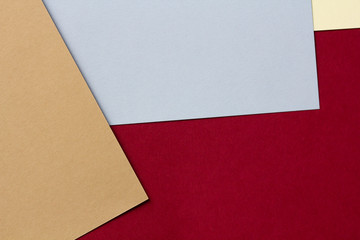 Colored cardboards background in blue,yellow,red and brown. Copy space.