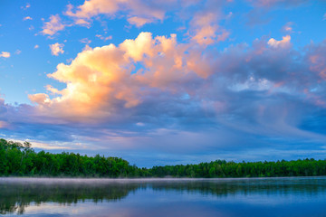 Beautiful reflection trees blue lake waters 