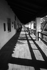 Black and White image of the walkway at the historic Mission de Alcala San Diego, California