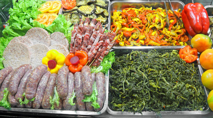 a self service canteen with meat sausages peepers