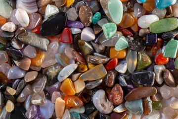 background from multicolored polished stones background texure close up