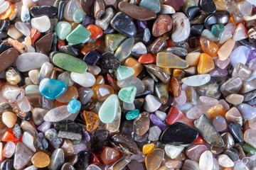background from multicolored polished stones background texure close up