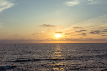 Colorful orange and purple sunset on the Pacific Ocean in La Jolla, San Diego California.