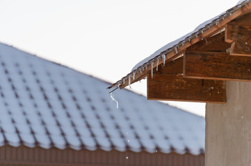 snow on the roof of houses