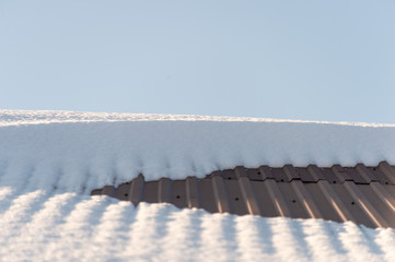 snow on the roof of houses