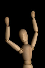 Business and Design Concept - Wooden Mannequin with Open Arm Gesture Isolated on Black Background