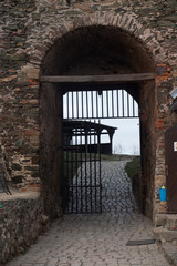 Fototapeta premium gate in the defensive wall of the old castle Bolkow
