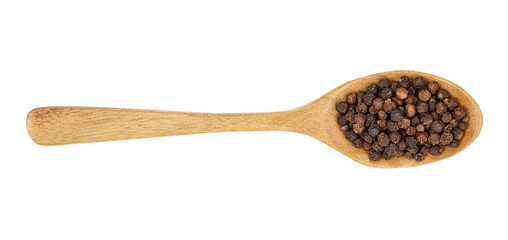 Black peppercorn in a wooden spoon isolated on white background. Top view