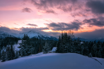 sunset in the snowy austrian mountains	