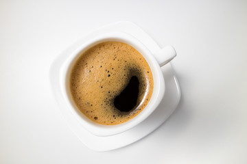 Coffee espresso. Coffee cup on white background closeup. Morning, breakfast, energy concept. Top view