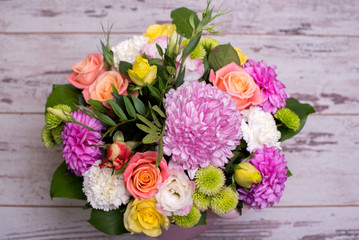 beautiful floral arrangement in the box, pink and yellow rose, pink eustoma, green and pink...