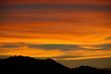 Brilliant pink sunset over the mountains in San Diego California