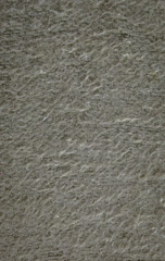 rough fleecy fabric with fiber and wool, close-up.