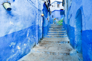 blue street with stair and doors in blue city Chefchaouen in Morocco
