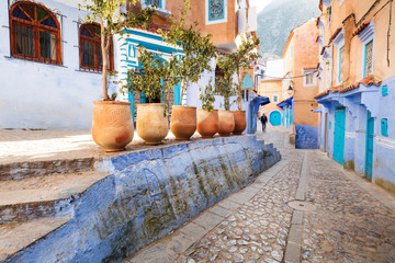 Naklejka premium six vases on the street in blue city Chefchaouen in Morocco