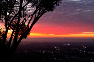Brilliant Red sunset off Mt Helix overlooking San Diego