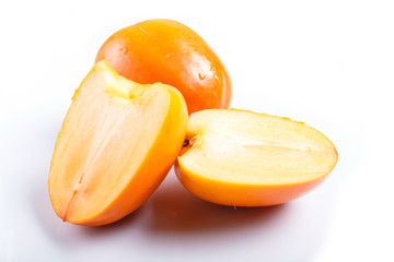 Ripe orange persimmon isolated on white background.