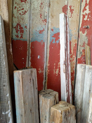 Colorful rustic vintage old wood leaning against a wall