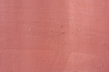 Metal texture background with pale red worn paint