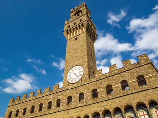 Obraz premium Palazzo Vecchio, the Old Palace in Florence, Italy, partial exterior view from below against a beautiful summer sky