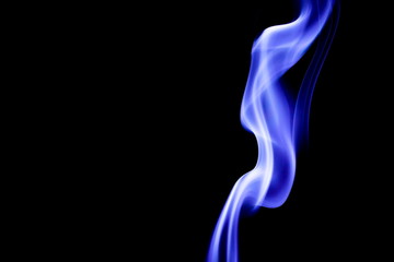 Blue smoke on black background