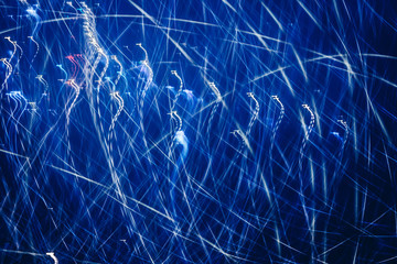 Abstract background with neon blue lights.