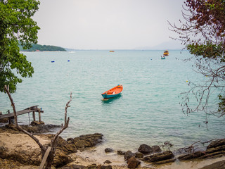 Red rowing boat on a beach
