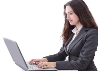 side view.business woman typing on a laptop.