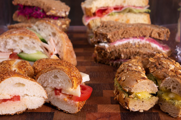 Beautifully decorated catering banquet table with different food snacks and appetizers with sandwich, on corporate christmas birthday kids party event or wedding celebration