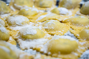 Making italian pasta Ravioli for Christmas, child with grandparents