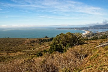 Fototapeta na wymiar View of Stinson Beach and the Bolinas Lagoon from Mountain Tamalpais, with beautiful blue sky and cloud formation