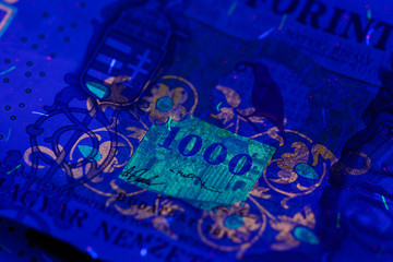 HUF 10,000 Hungarian banknote in UV light. Fluorescent motives are clearly visible. Europe Hungary.