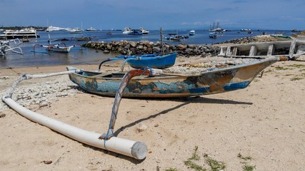 Old fisherman’s boat on the beach in Sammer Harbour in Bali