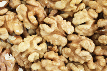 Food background - big shelled walnuts situated arbitrarily
