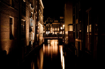 Obraz na płótnie Canvas Amsterdam night landscape, night city concept. Architecture landmark city. Night lights
