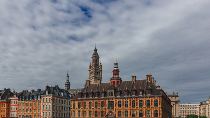 Fototapeta premium Clock tower of the Chamber of Commerce building and the old stock exchange building, in downtown Lille, France