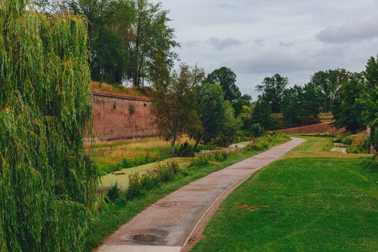 Path between trees and citadel walls, near the Citadel of Lille, France