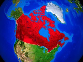 Canada from space on model of planet Earth with country borders and very detailed planet surface.