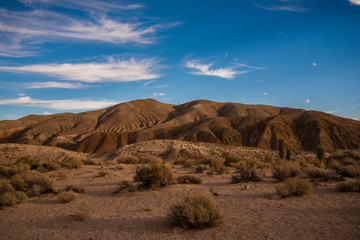 Mojave desert landscape with hills and clouds