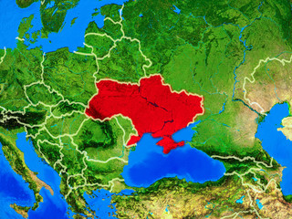 Ukraine from space on model of planet Earth with country borders and very detailed planet surface.