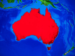 Australia from space on model of planet Earth with country borders and very detailed planet surface.