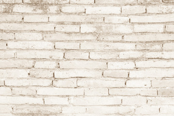 Cream colors and brown brick wall art concrete or stone texture background in wallpaper limestone abstract paint to flooring and homework/Brickwork or stonework clean grid uneven interior rock old.