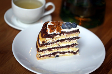 Macro photo of tasty cake with berries and tea