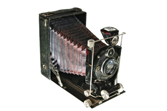 Old camera with an accordion lens. On a white background