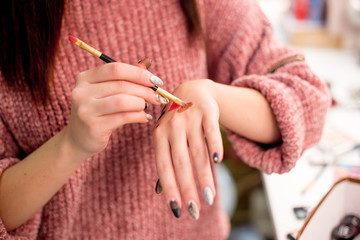 Professional makeup artist working on young girl