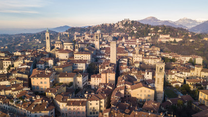 Fototapeta na wymiar Bergamo, Italy. Drone aerial view of the old town. Landscape at the city center and its historical buildings during winter time
